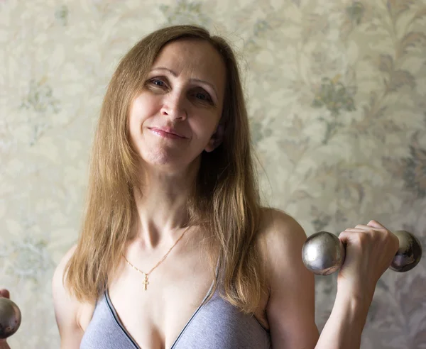 Woman with dumbbells — Stock Photo, Image