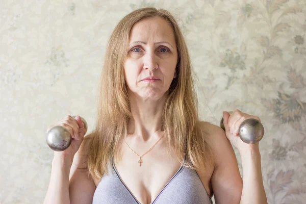 Woman with dumbbells — Stock Photo, Image