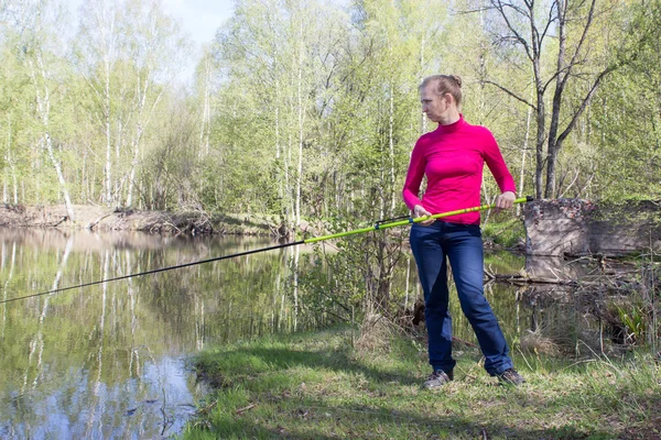 Woman fishing on daughter — Stock Photo, Image