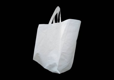 Siyah Arkaplan 'da beyaz kumaş saplı bir çanta. ECO-Friendly Polypropylene Bag. Biyo-çözünebilir alışveriş çantası. Model çanta. Yeniden kullanılabilir ambalaj. Boş tek kullanımlık tek kullanımlık çevre kutusu torbasını market için geri dönüştür 