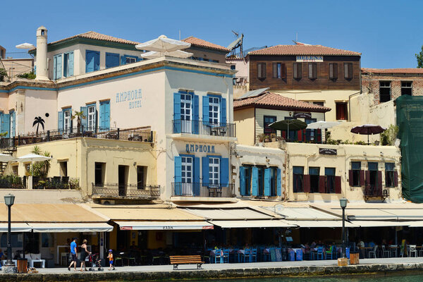 Chania, Greece - August 12: City buildings at Harbor of Chania, Greece on August 12, 2014. Chania is one of the most popular tourist place on Crete island in Greece.