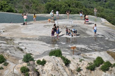 Oaxaca Mexico - July 12, 2023: Unidentified people chill in the pools of the Hierve el Aqua hot springs in the state of Oaxaca Mexico