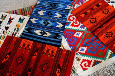 Merida, Mexico - June 11, 2023: Colorful Fabric and carpets for sale in Merida city old town, Yucatan, Mexico