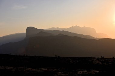Mountains landscape at sunset in Sultanate of Oman, Hajar Mountains, Arabian Peninsula