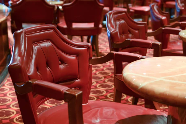 Wooden chair with red leather in a bar — Stock Photo, Image