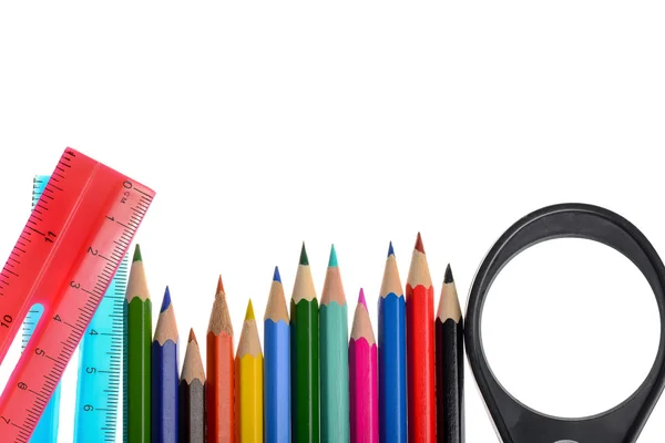 Crayons, lupa e duas réguas — Fotografia de Stock