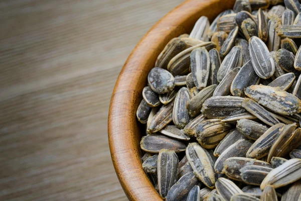 Sunflower seeds in bowl — Stock Photo, Image