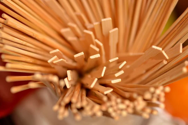 A lot of toothpicks in a container — Stock Photo, Image