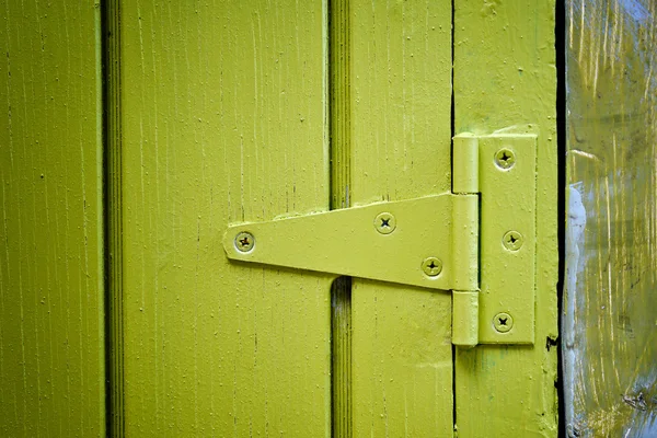 Yellow door hinge — Stock Photo, Image