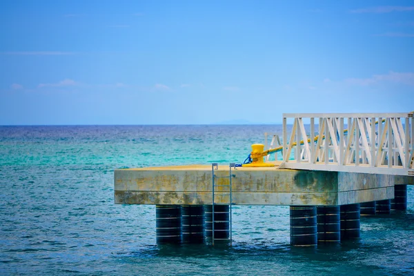 Isolated stone pier — Stock Photo, Image