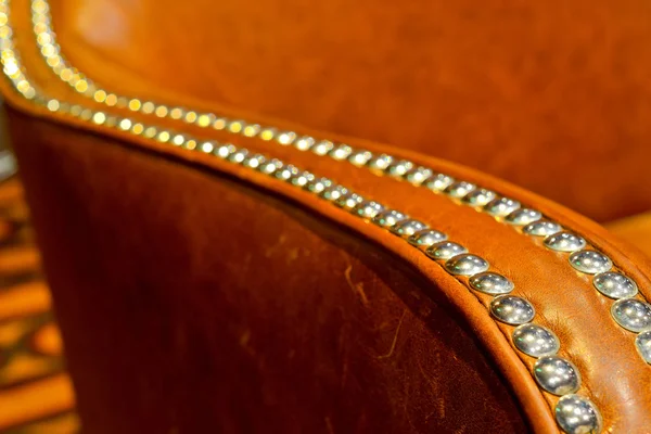 Macro details of a brown leather arm chair — Stock Photo, Image