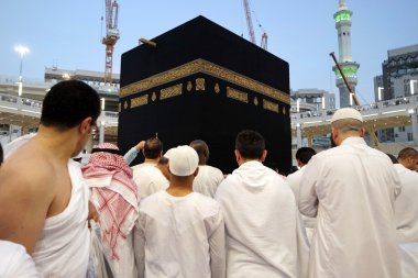 Muslims wearing ihram in Kaaba clipart