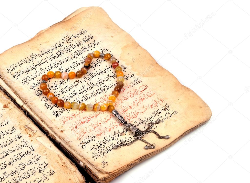 Manuscript Holy Quran and Muslim prayer beads