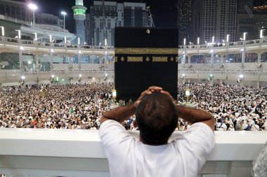 Muslim praying in  Kaaba Makkah clipart