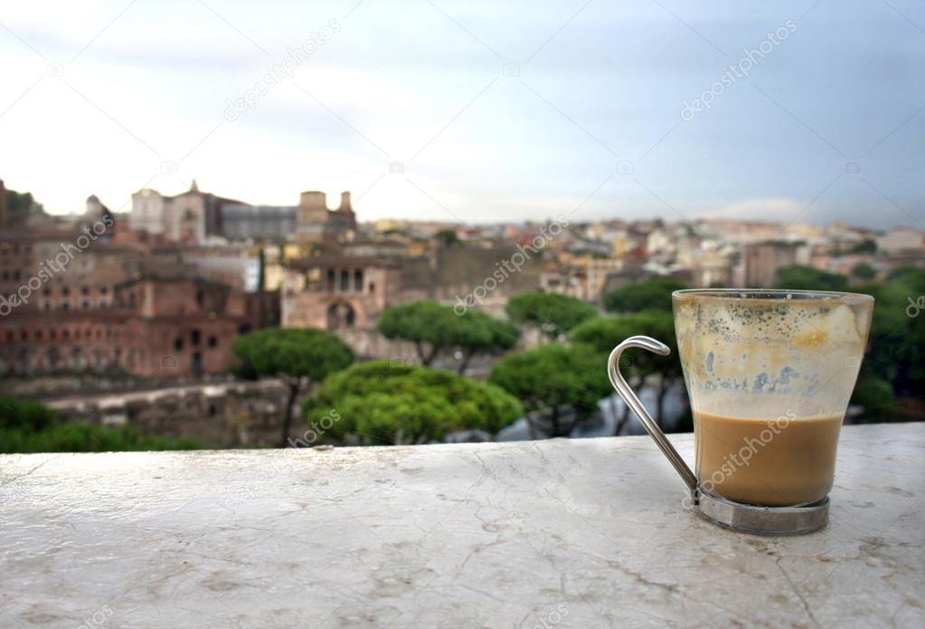 Beautiful view of Rome and cup with cafe latte 