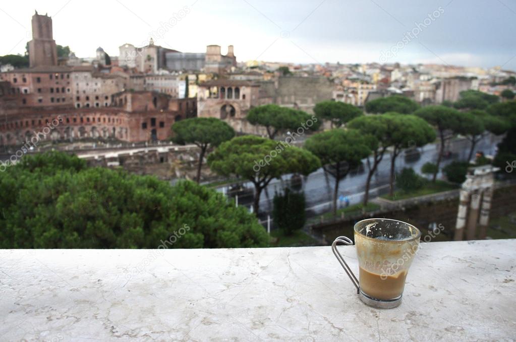 Beautiful view of Rome and cup with cafe latte 