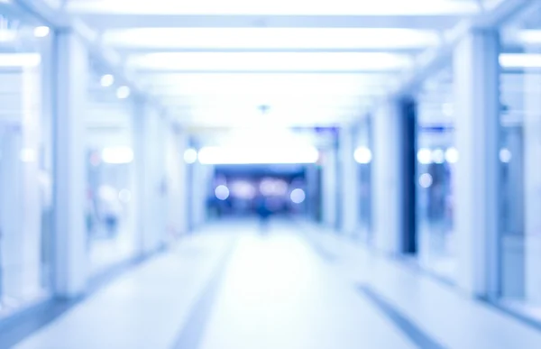 abstract defocused blurred background, empty business corridor or shopping mall. Medical and hospital corridor defocused background with modern laboratory (clinic)