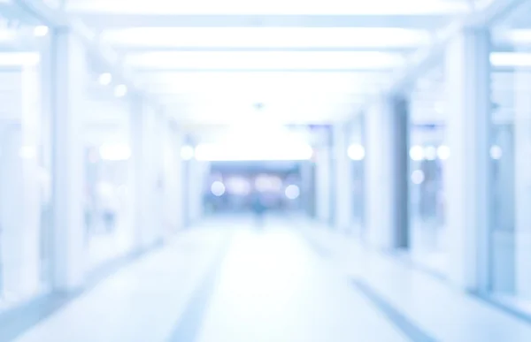 Abstract defocused blurred background, empty business corridor or shopping mall. Medical and hospital corridor defocused background with modern laboratory (clinic) — Stock Photo, Image