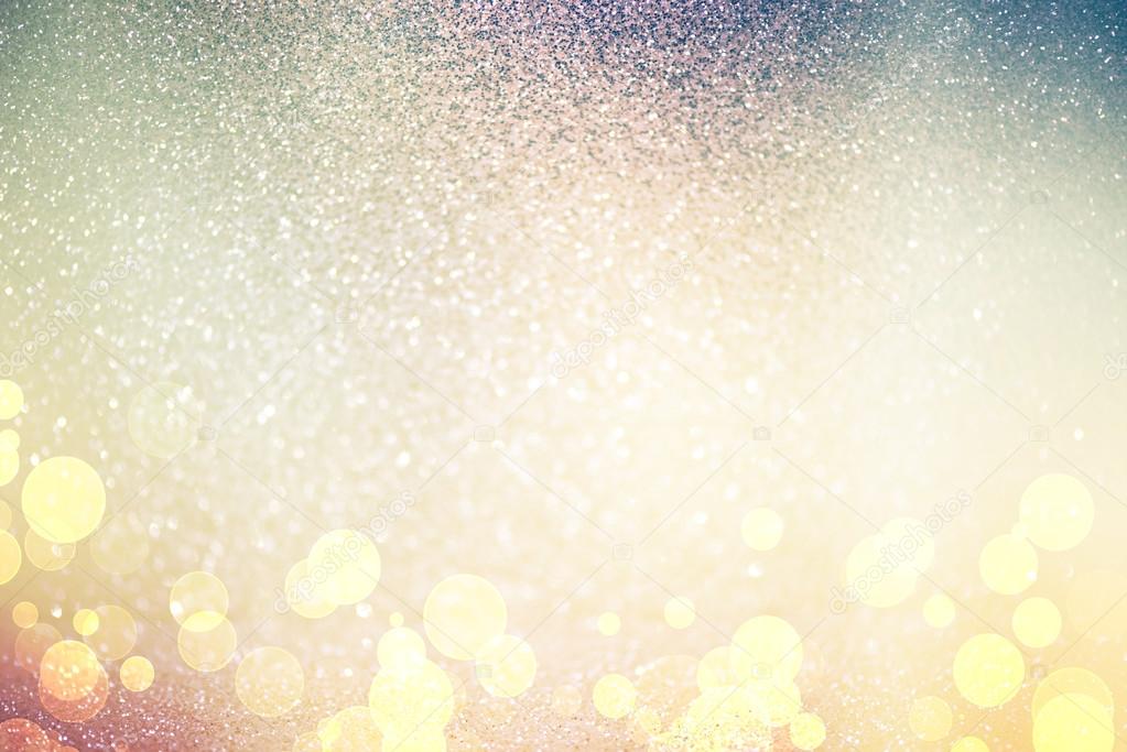 abstract defocused lights, sparkling holiday bokeh background with golden tones, elegant christmas backdrop