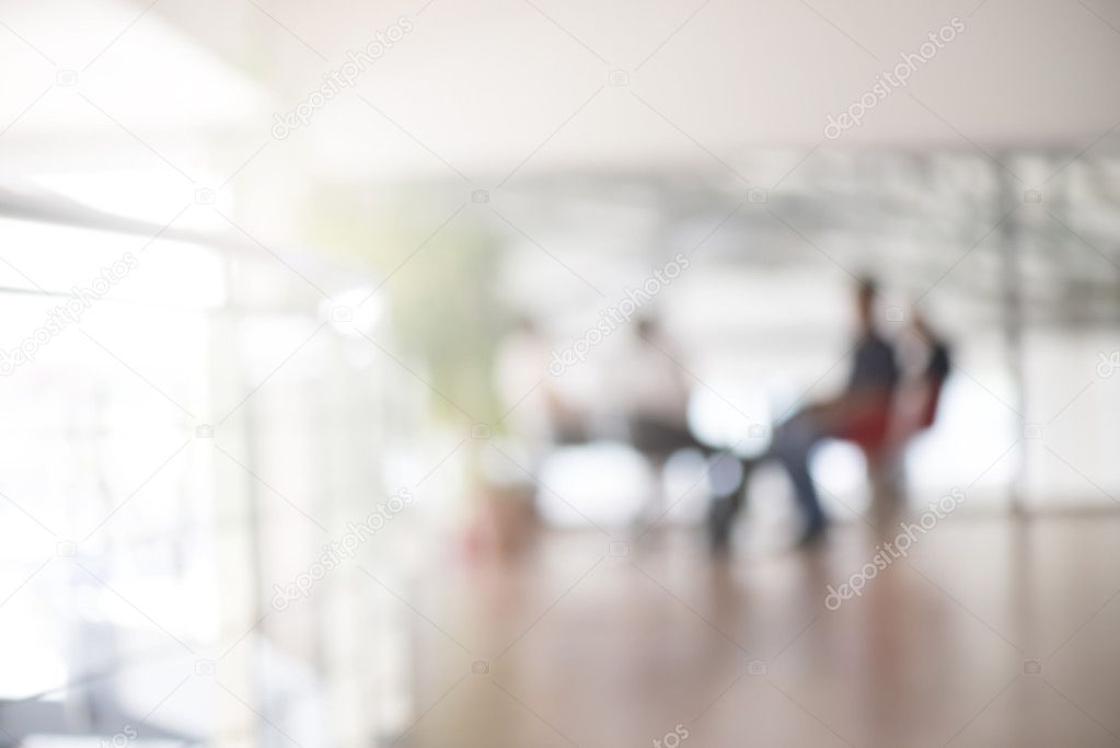 blur interior of modern office with business people on meeting