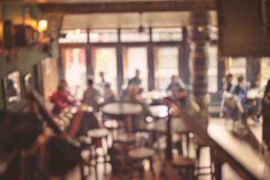 İnsanlar kafede bokeh ışıklı arka plan vintage filtre için eski etkisi, arka plan bulanık bulanıklık