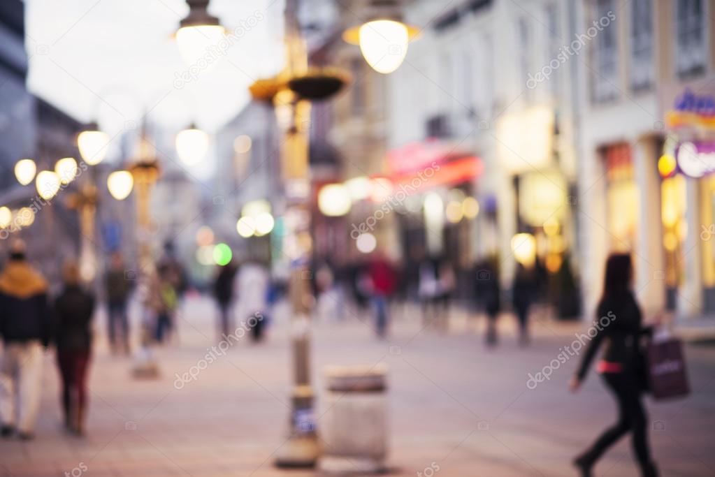 Abstract blurred background of people walking in city center