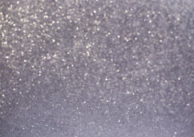 Gümüş pırıltılı Noel ışıkları. Bulanık arka plan