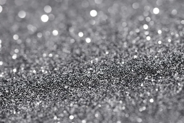 Gümüş pırıltılı Noel ışıkları. Bulanık arka plan