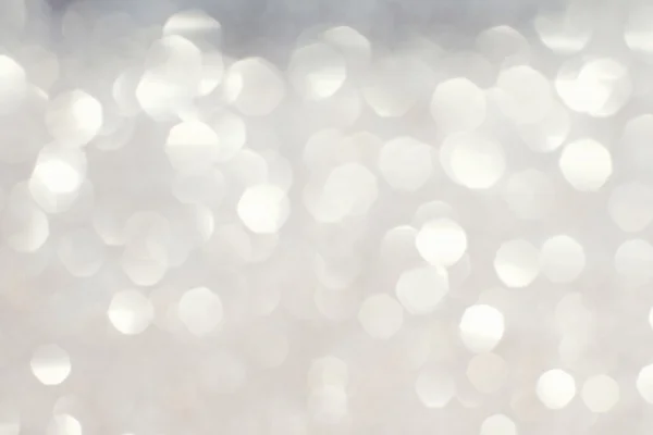 Silver white glittering Christmas lights. Blurred abstract backg — Stock Photo, Image