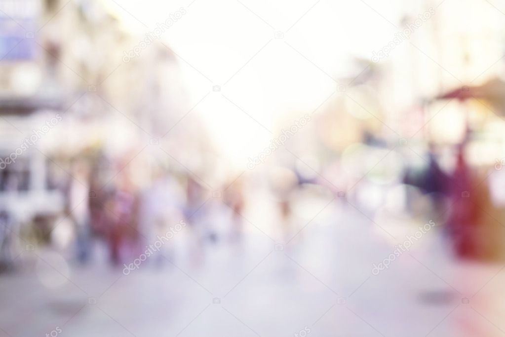 abstract photo of people in motion. Blurred people walking through a city street