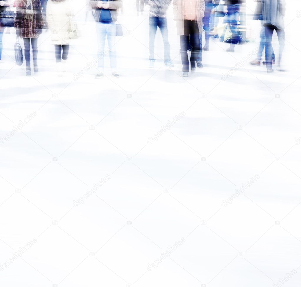 abstract photo of people in motion. Blurred people walking through a city street