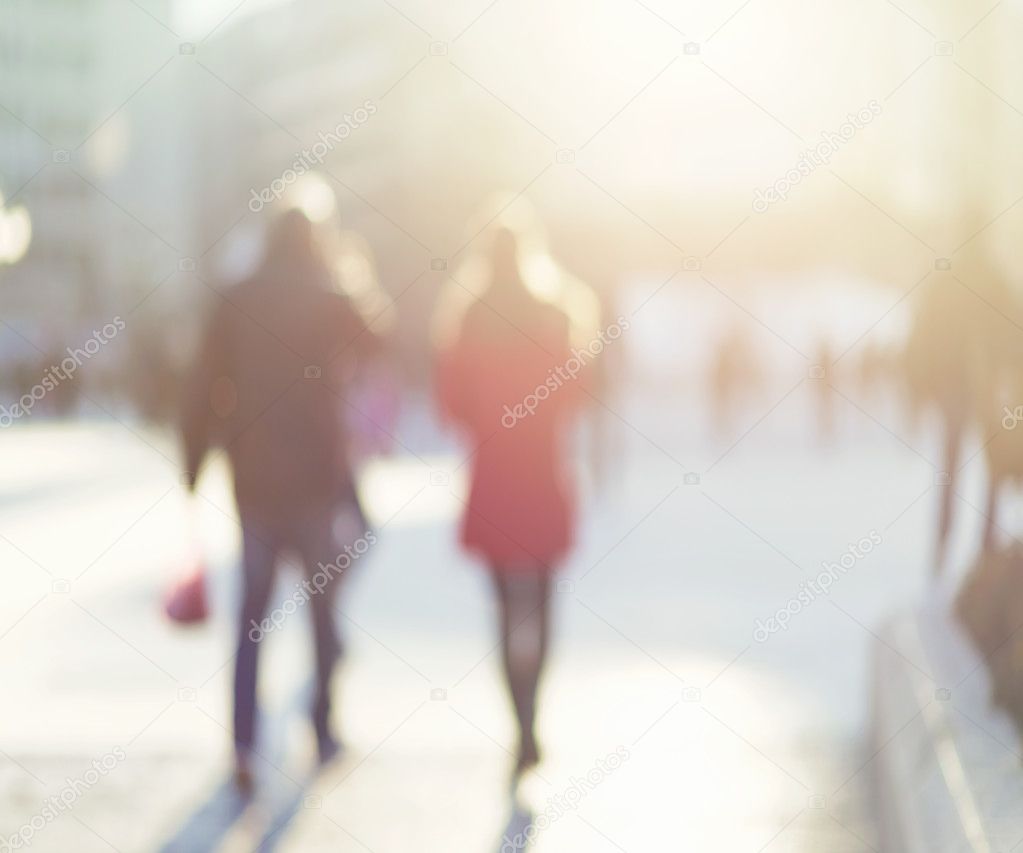 blur abstract people background, unrecognizable silhouettes of people walking on a street