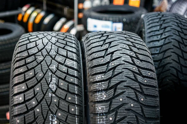 Closeup view of two studded winter tires with different treads — Stock Image Closeup View Two Studded Winter Tires Different Treads Stock Photo