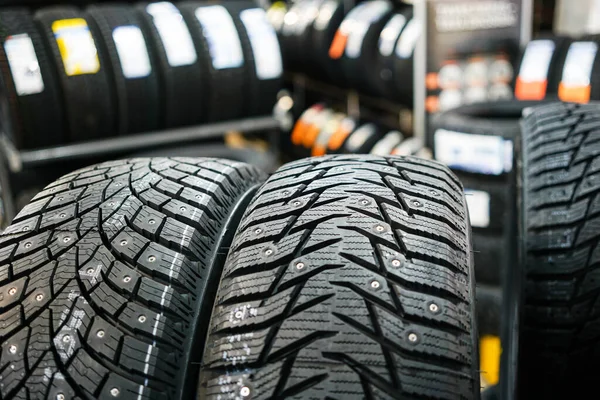 Closeup view of two studded winter tires with different treads — Stock Image Closeup View Two Studded Winter Tires Different Treads Stock Picture