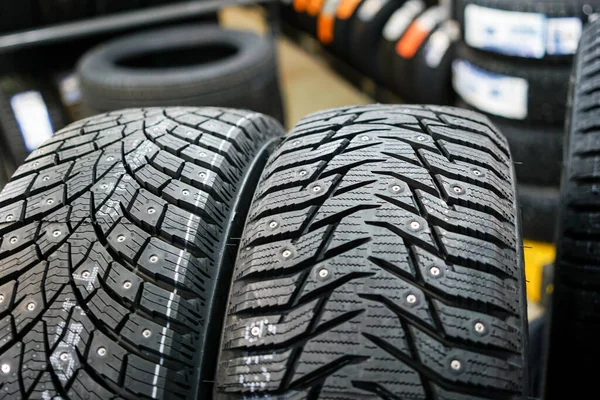 Closeup of the tread of two different studded winter tires — Stock Image Closeup of the tread of two different studded winter tires Royalty Free Stock Images