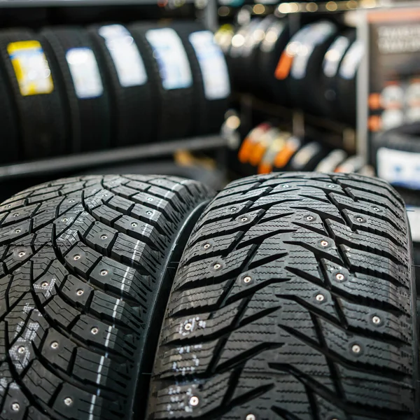 Closeup view of two studded winter tires with different treads — Stock Image Closeup View Two Studded Winter Tires Different Treads Stock Picture