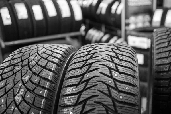 Closeup view of two studded winter tires with different treads — Stock Image Closeup View Two Studded Winter Tires Different Treads Stock Photo