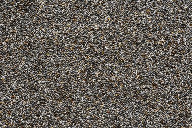 Chia çekirdeği arka planı, bir sürü chia çekirdeğinin yakın plan görüntüsü