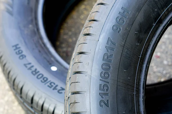 Side view of new tire with tire width, height and wheel diameter designation