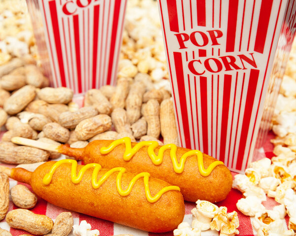 delicious corn dogs with popcorn and peanuts