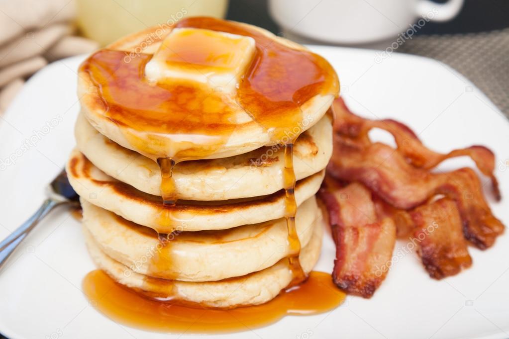 Pancakes with butter, dripping syrup and bacon Stock Photo by ©adogslifephoto 84650298