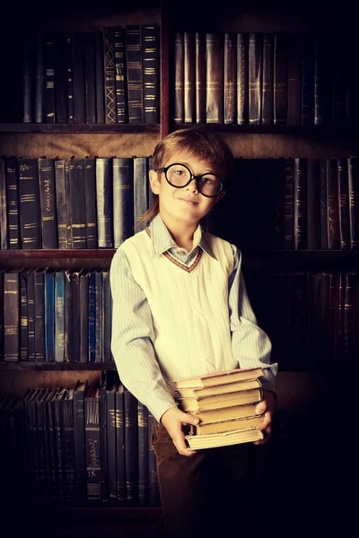 stock image child in a library