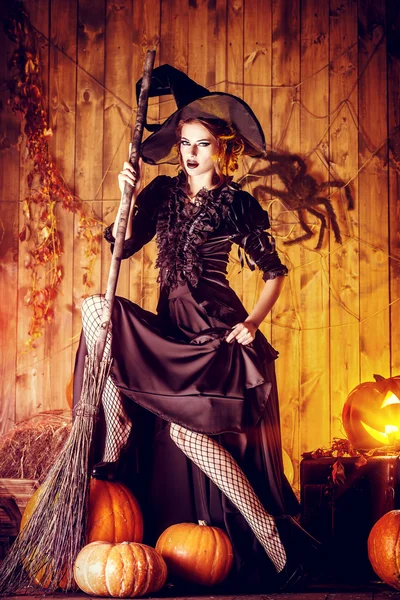elegant witch with broomstick