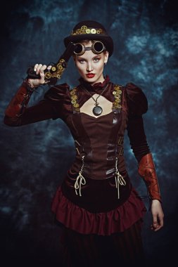 Steampunk konsepti. Klasik bir geçmişi olan, kendine güveni tam, güzel bir kızın portresi..