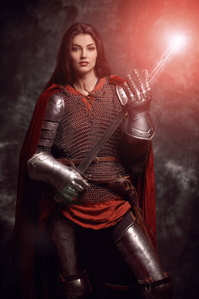 Era of romanticism. Portrait of a beautiful female knight in armor of noble birth. The Middle Ages history.