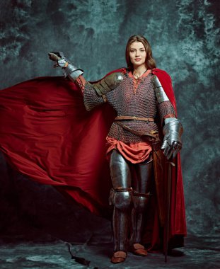Full length portrait of a beautiful female knight in armor of noble birth. History of the Middle Ages. clipart