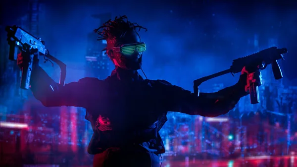 A courageous cyberpunk warrior fights with automaticguns in his hands against the backdrop of the night city of the future. Game, virtual reality. Cyberpunk concept.