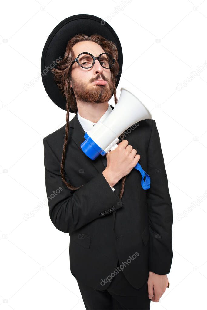 A pompous traditional Jew holds a loudspeaker and frowns. Studio shot on a white background. 