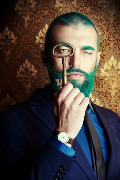 https://st2.depositphotos.com/1606463/9957/i/450/depositphotos_99576582-stock-photo-golden-key-brutal-man-with.jpg