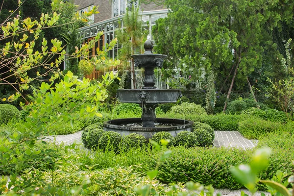 Nature background. Fountain in english garden design. — Stockfoto
